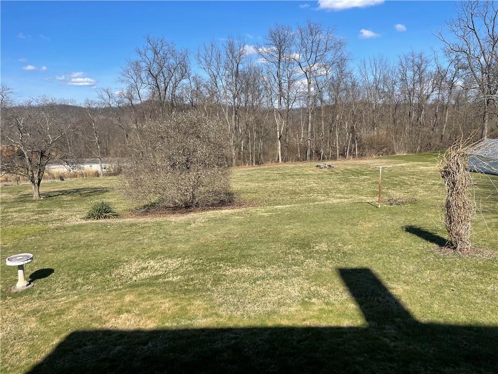 943 Newell Road Fayette City, PA 15438 - Photo 21 of 27 a view of a yard with an outdoor space