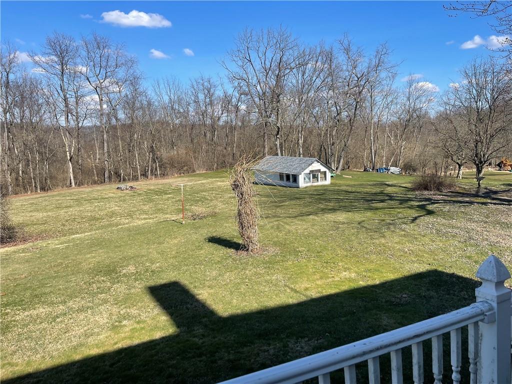 943 Newell Road Fayette City, PA 15438 - Photo 22 of 27 a view of a swimming pool with an outdoor space and seating area