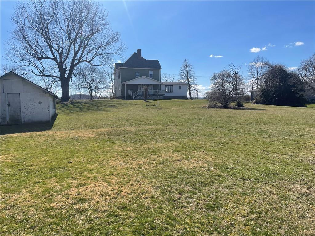 943 Newell Road Fayette City, PA 15438 - Photo 23 of 27 a view of a house with a yard