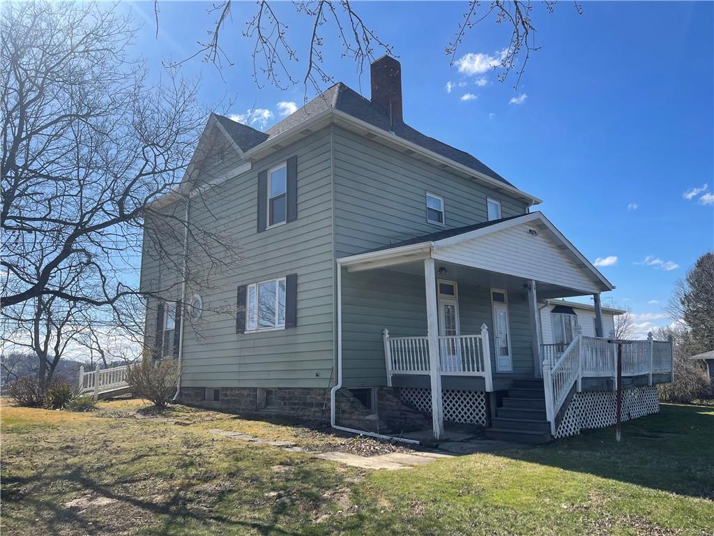 943 Newell Road Fayette City, PA 15438 - Photo 26 of 27 a house with a yard