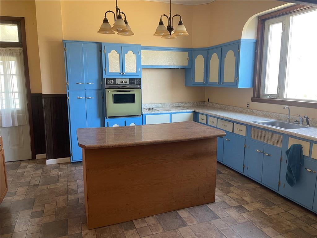 943 Newell Road Fayette City, PA 15438 - Photo 10 of 27 a kitchen with stainless steel appliances granite countertop a stove a sink and a refrigerator