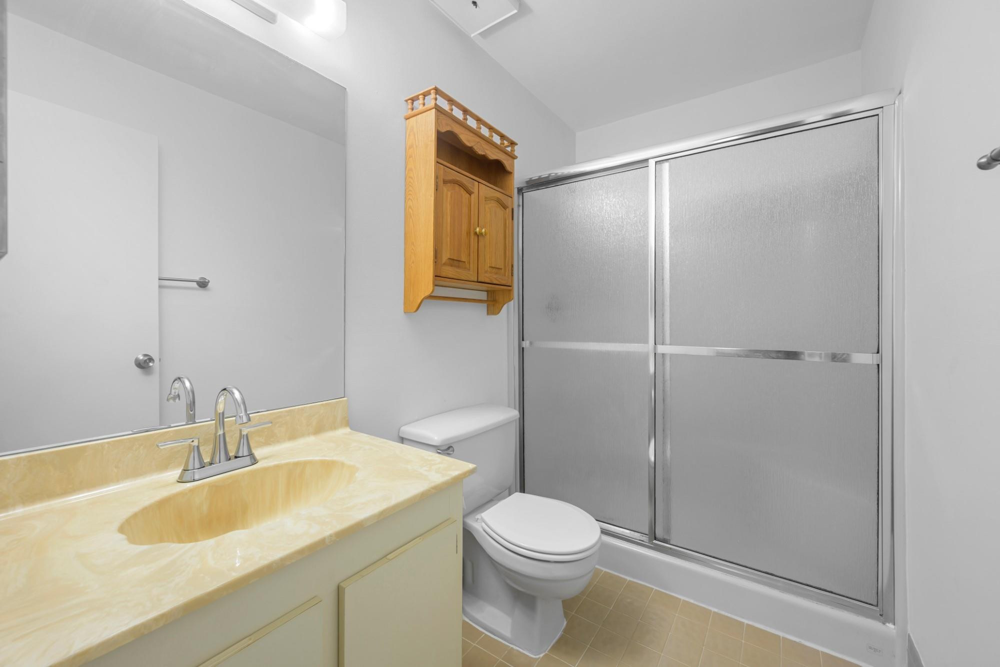 6371 Boca Circle Boca Raton, FL 33433 - Photo 17 of 24 a bathroom with a granite countertop sink toilet and shower