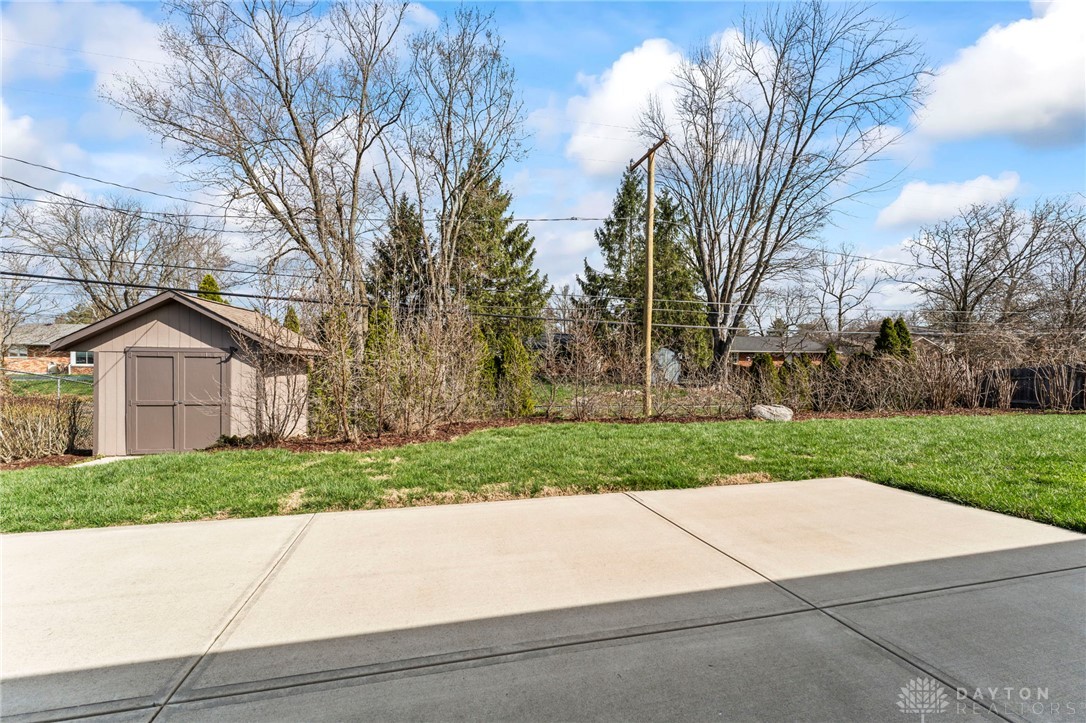 2247 East Whipp Road Dayton, OH 45440 - Photo 5 of 52 This spacious yard features a concrete patio, perfect for outdoor entertaining.