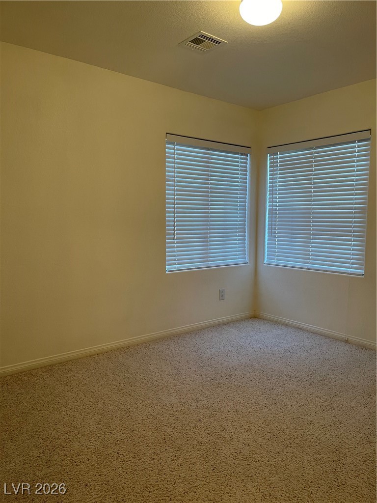 9975 Willowbrook Pond Road Las Vegas, NV 89148 - Photo 16 of 18 Spare room with carpet floors and baseboards