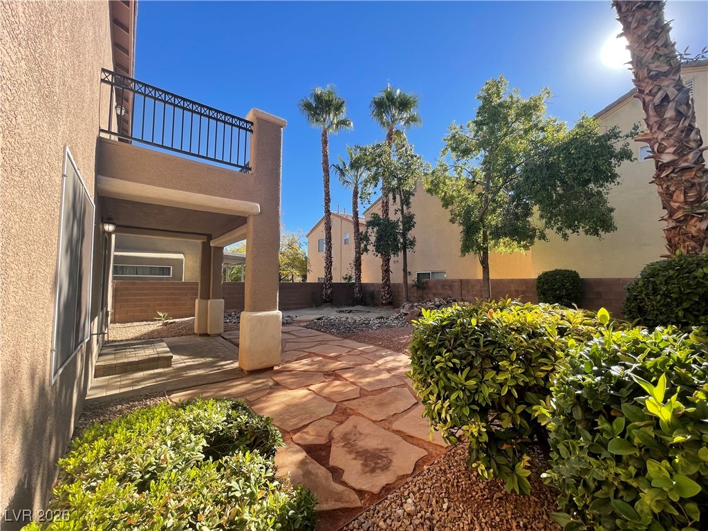 9975 Willowbrook Pond Road Las Vegas, NV 89148 - Photo 17 of 18 Fenced backyard with a patio