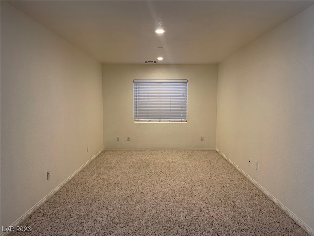 9975 Willowbrook Pond Road Las Vegas, NV 89148 - Photo 9 of 18 Empty room featuring carpet floors and recessed lighting
