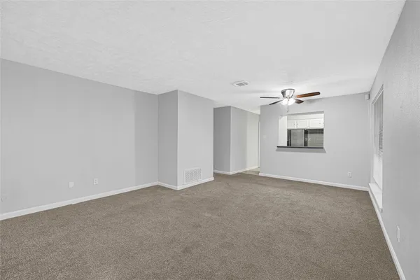 a view of a hallway with a door