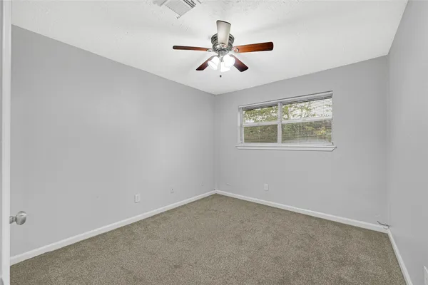 a bed room with two bed and a desk