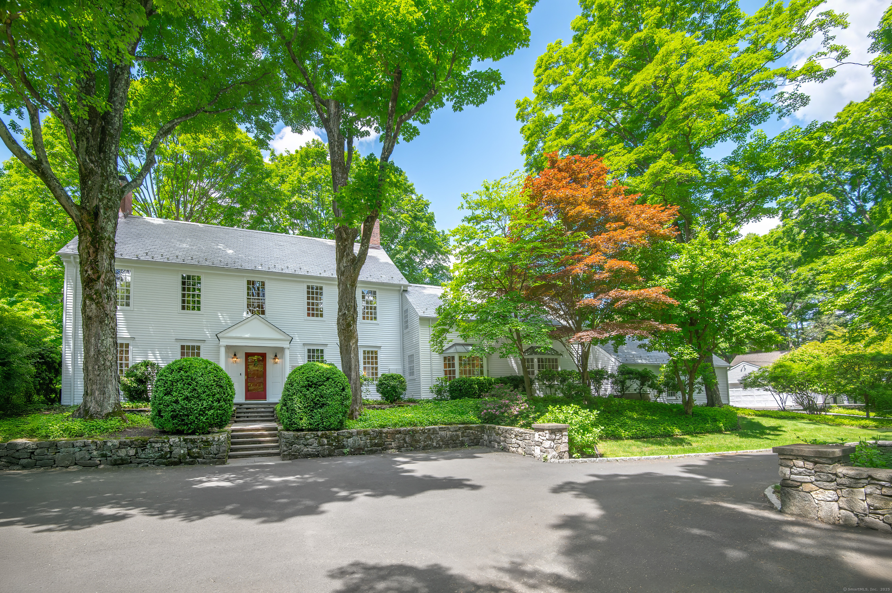 379 Hurlbutt Street Wilton, CT 06897 - Photo 1 of 1 a front view of a house with garden