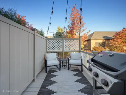 a balcony view with a seating space
