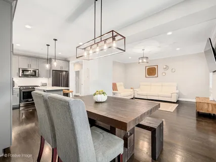 a view of kitchen and dining area with furniture