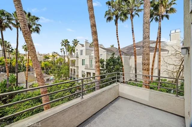 a view of balcony with potted plants