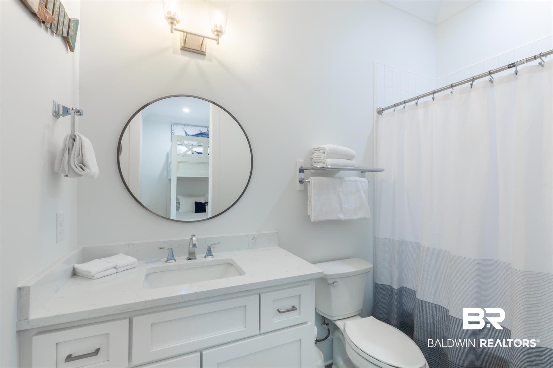 2494 Saltgrass Way Orange Beach, AL 36561 - Photo 18 of 37 Bathroom featuring vanity, toilet, and a shower with shower curtain