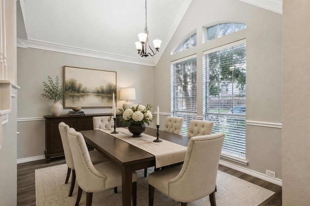 400 Moss Hill Road Irving, TX 75063 - Photo 6 of 26 Dining Area Featuring Crown Moulding and Luxury Vinyl Plank Flooring
