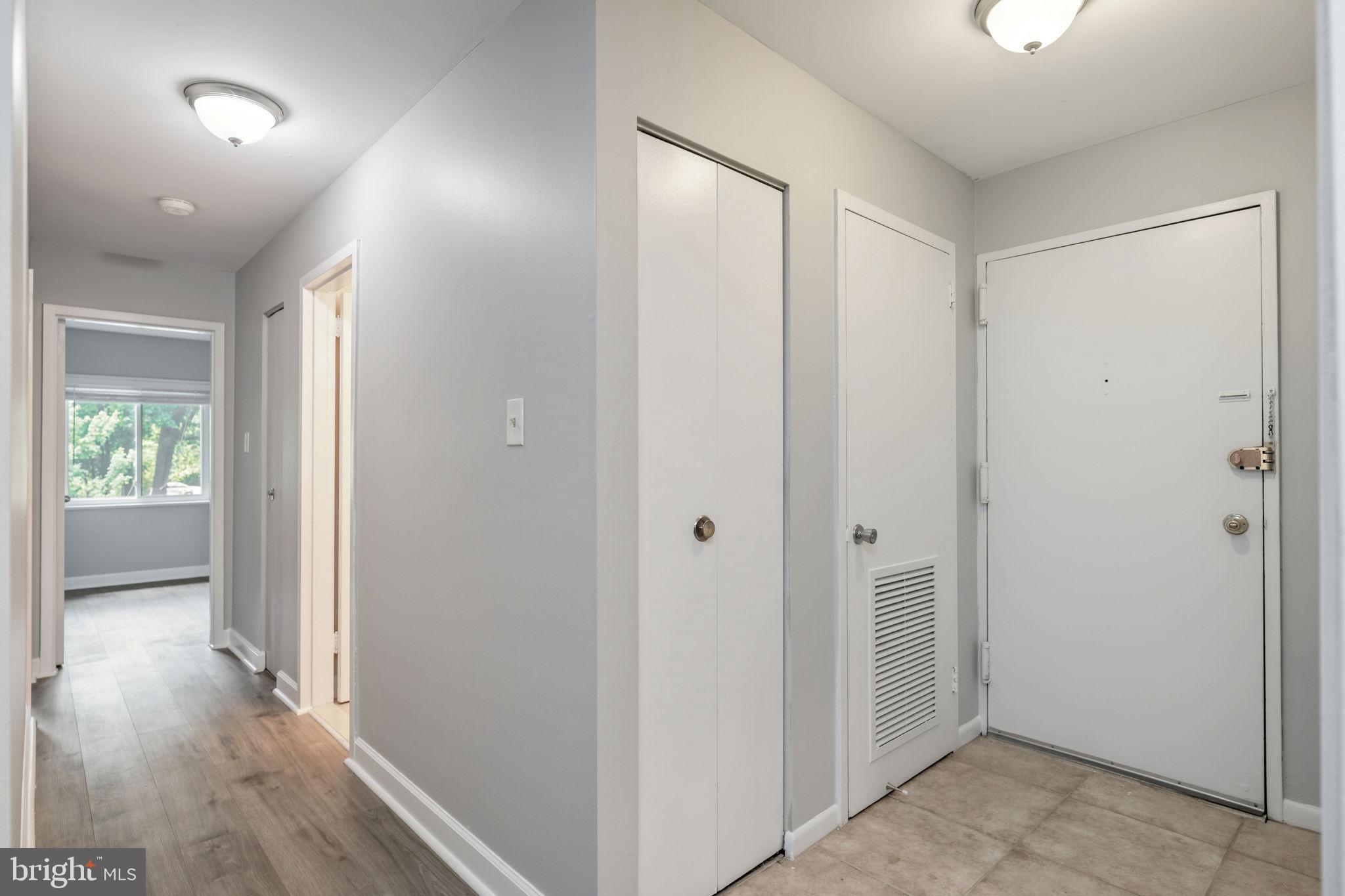 1443 Northgate Square, Unit 22B Reston, VA 20190 - Photo 24 of 42 a view of a hallway with wooden floor