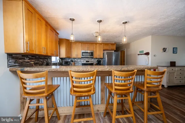a view of a living room and dining room