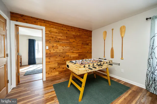 a bathroom with a toilet and a mirror