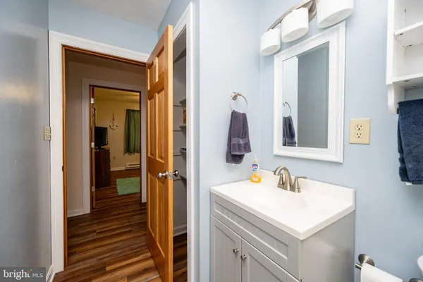 a spacious bedroom with a bed and a window