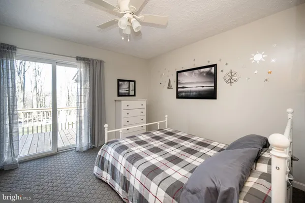a bedroom with furniture and a window