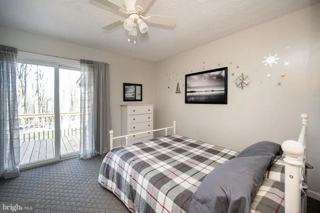 a bedroom with furniture and a window