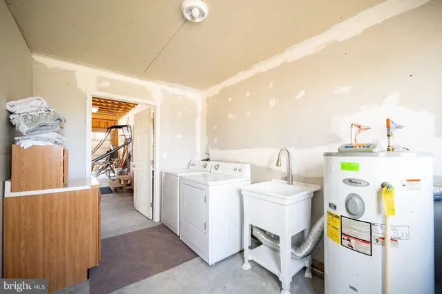 a bedroom with furniture and a book shelf