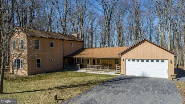 an aerial view of a houses with a lake view