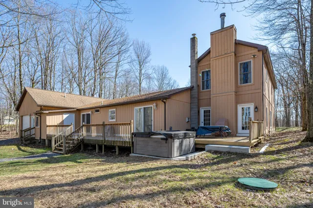 an aerial view of a houses with ocean view