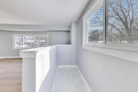 a view of a room that has a window in it