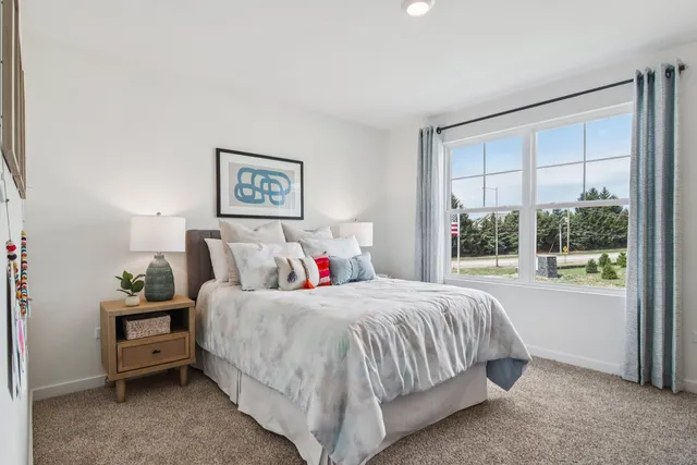 a kitchen with stainless steel appliances granite countertop a stove a microwave and a refrigerator