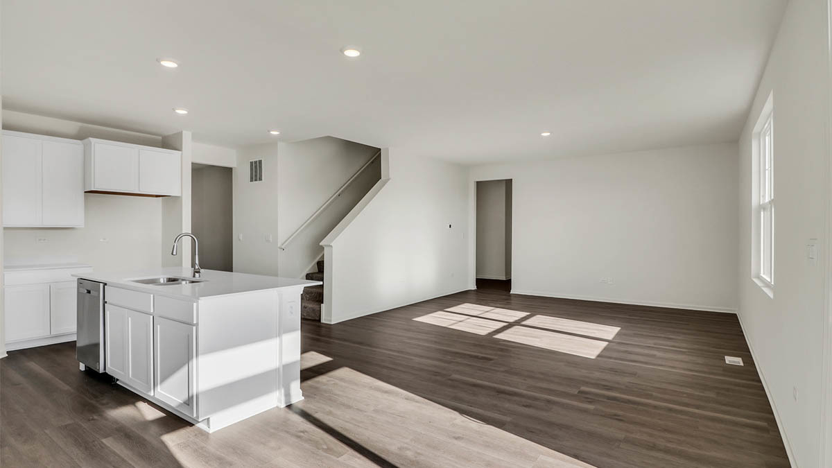 9947 Edgebrook Lane Huntley, IL 60142 - Photo 33 of 64 a view of an empty room with wooden floor and stairs