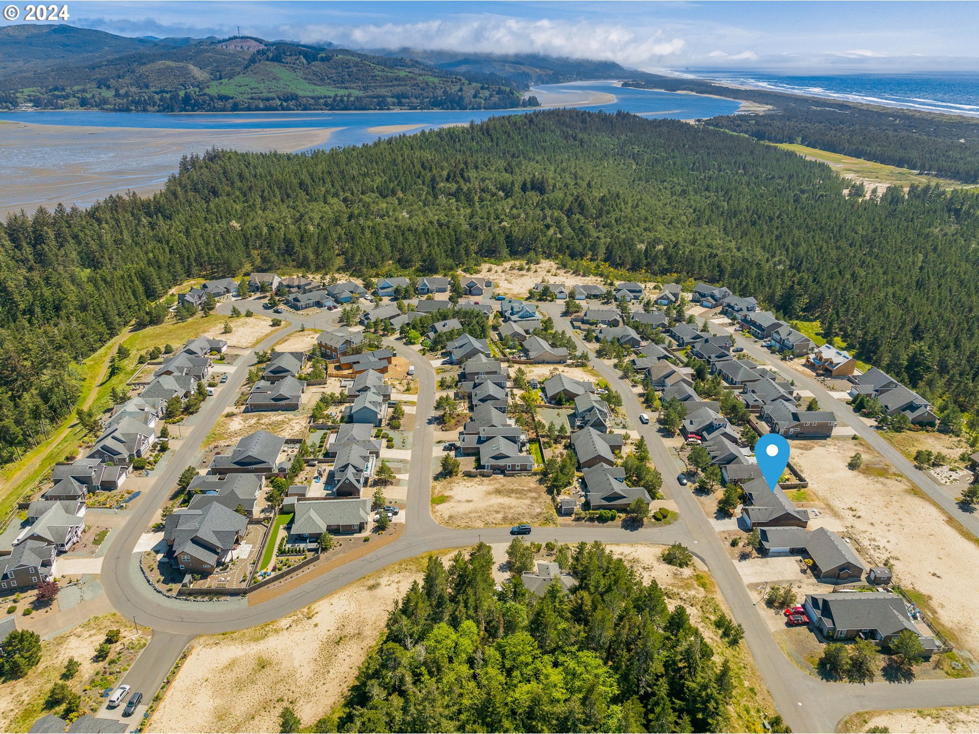 9980 Pine Ridge Drive Nehalem, OR 97131 - Photo 25 of 27 a view of a lake with a mountain