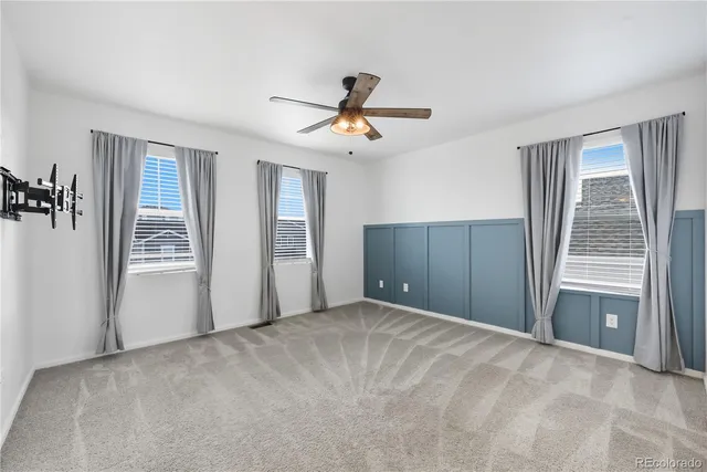 a view of a room with cabinet and windows
