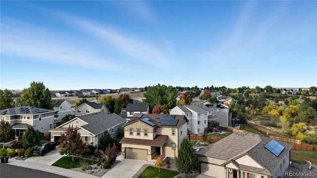 an aerial view of residential houses with city view