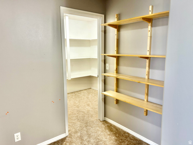 672 West 720 South Logan, UT 84321 - Photo 14 of 15 Customizable shelving system with five light wood-finish shelves