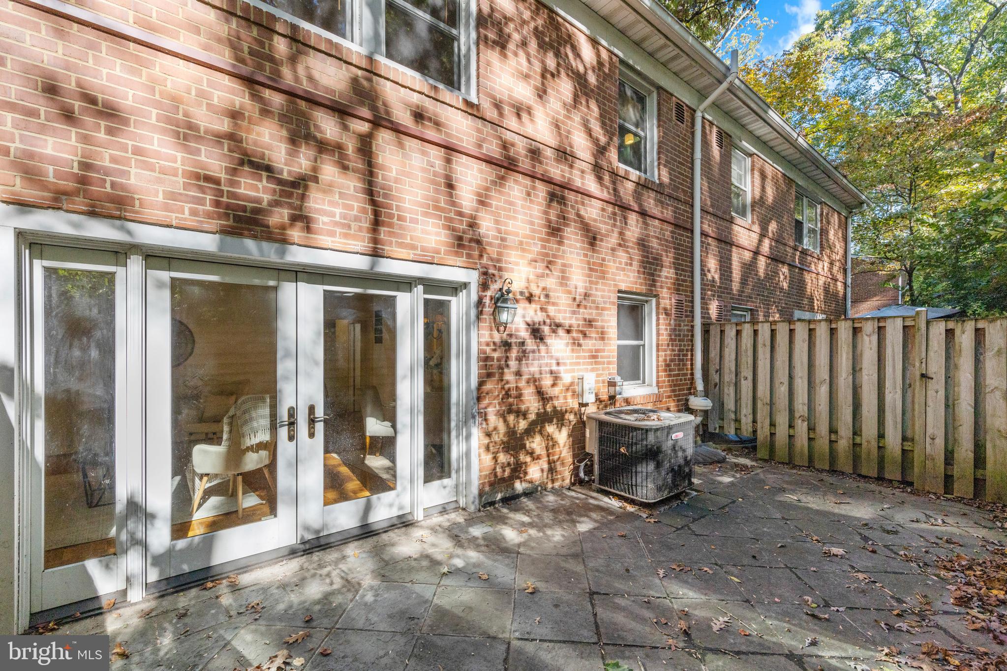 8547 Bradford Road, Unit 92 Silver Spring, MD 20901 - Photo 15 of 24 a view of a building with sitting area