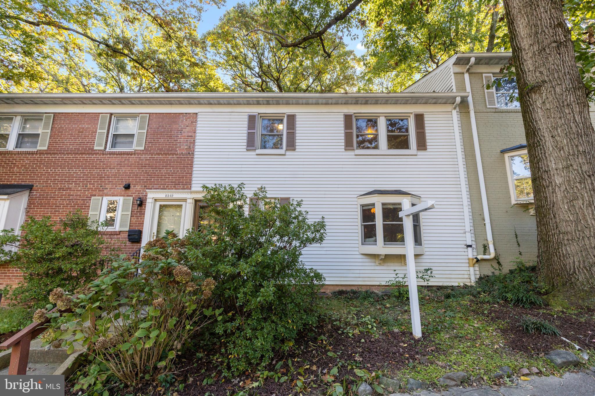 8547 Bradford Road, Unit 92 Silver Spring, MD 20901 - Photo 19 of 24 front view of house with a yard