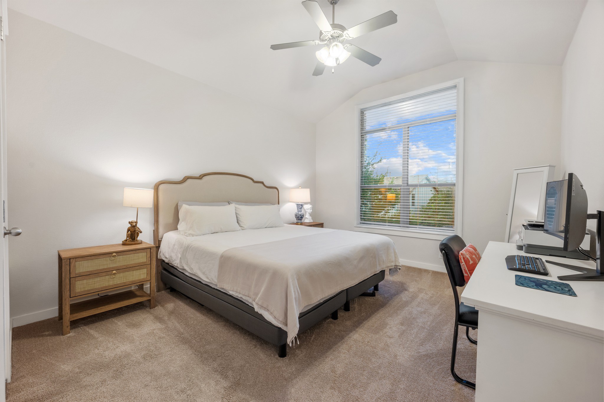 2101 Rivers Edge Way, Unit 19 Austin, TX 78741 - Photo 13 of 24 a bedroom with a bed and a chandelier