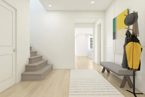 a view of a hallway with wooden floor and bathroom