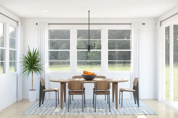 a dining room with furniture and windows