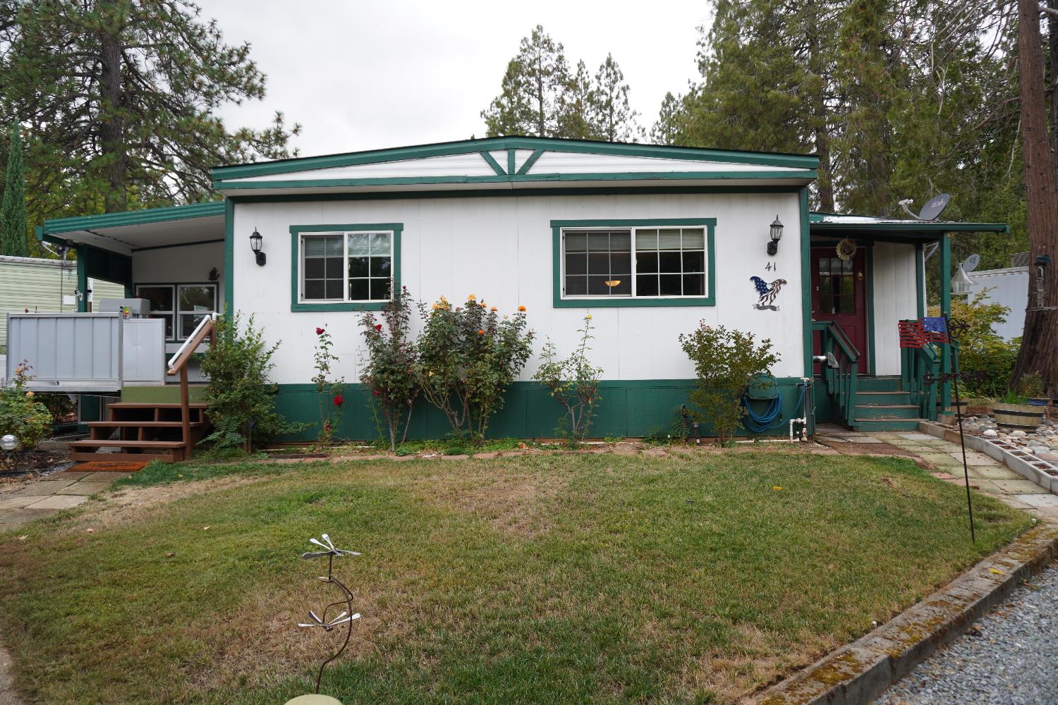 a front view of a house with garden