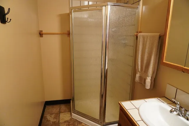 a bathroom with a sink and a mirror