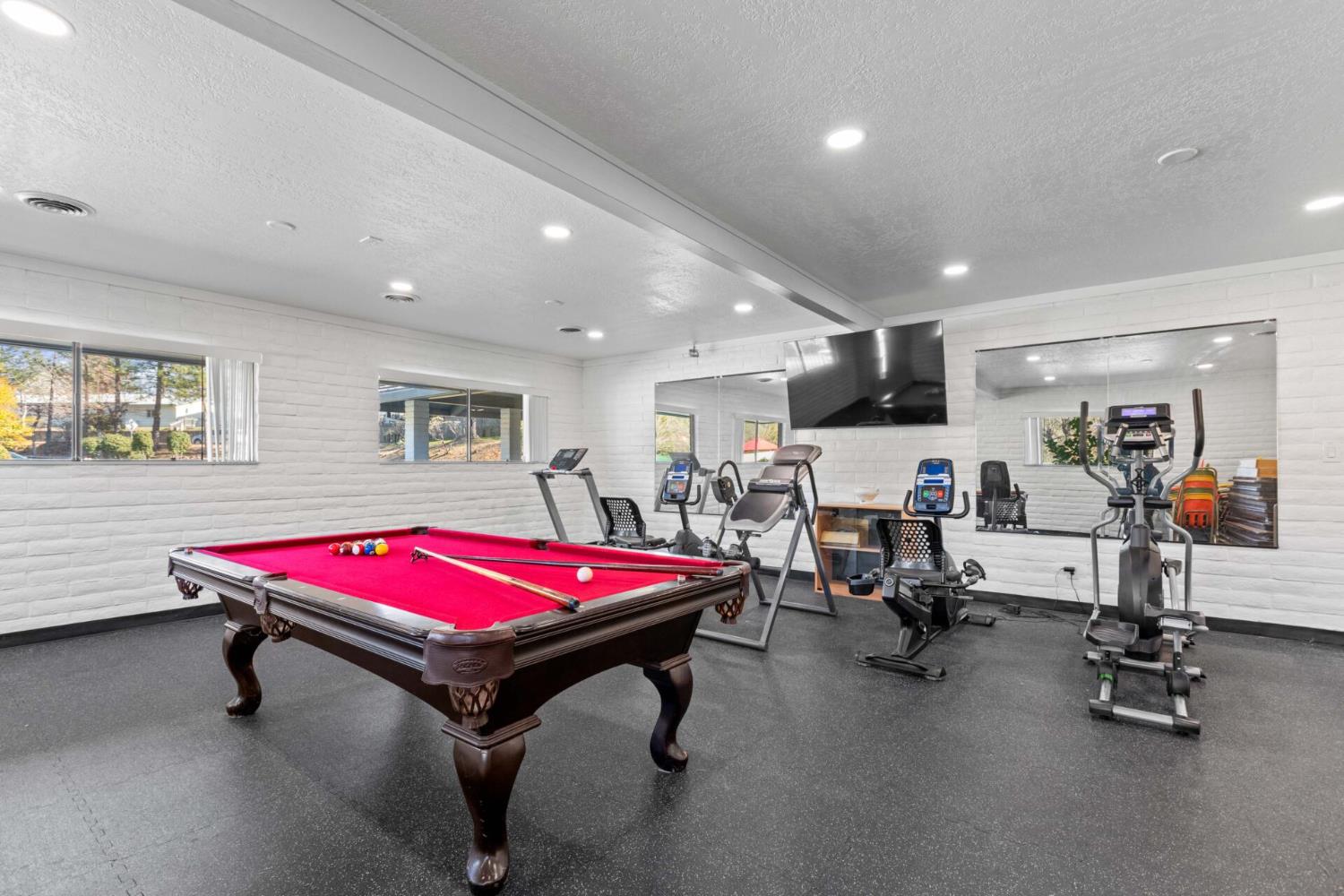 450 Gladycon Road, Unit 41 Colfax, CA 95713 - Photo 27 of 28 a room with gym equipment pool table and windows