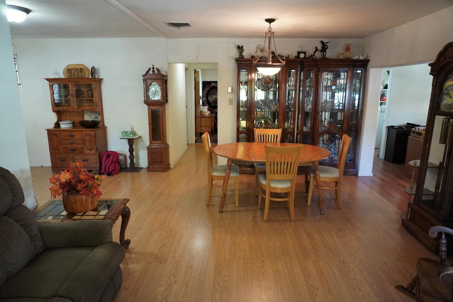 450 Gladycon Road, Unit 41 Colfax, CA 95713 - Photo 3 of 28 a dining room with furniture a chandelier and wooden floor