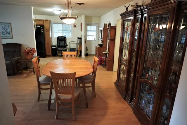 a dining room with furniture and window