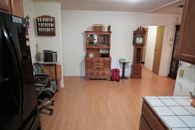 a view of a livingroom with furniture and a flat screen tv