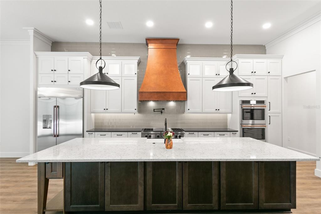 0 Plainview Road, Unit LOT 2 Odessa, FL 33556 - Photo 11 of 21 a kitchen with stainless steel appliances a sink a stove a refrigerator and a cabinets