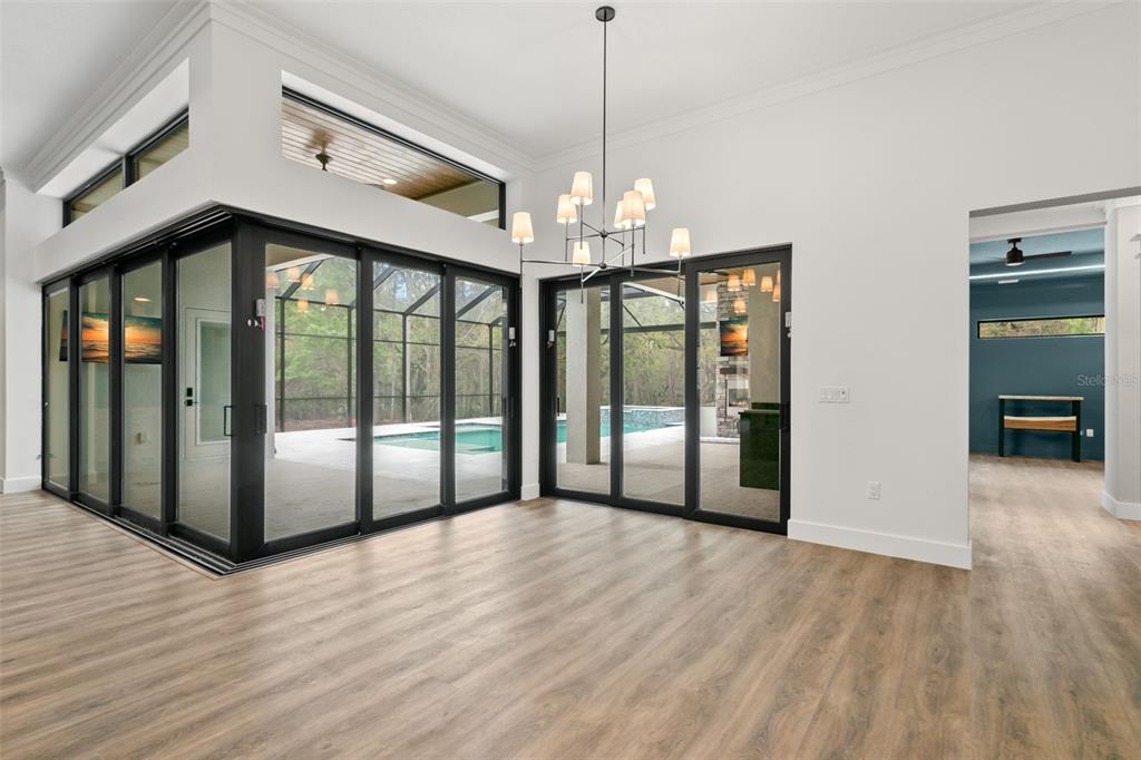 0 Plainview Road, Unit LOT 2 Odessa, FL 33556 - Photo 6 of 21 a view of a room with wooden floor staircase and a chandelier