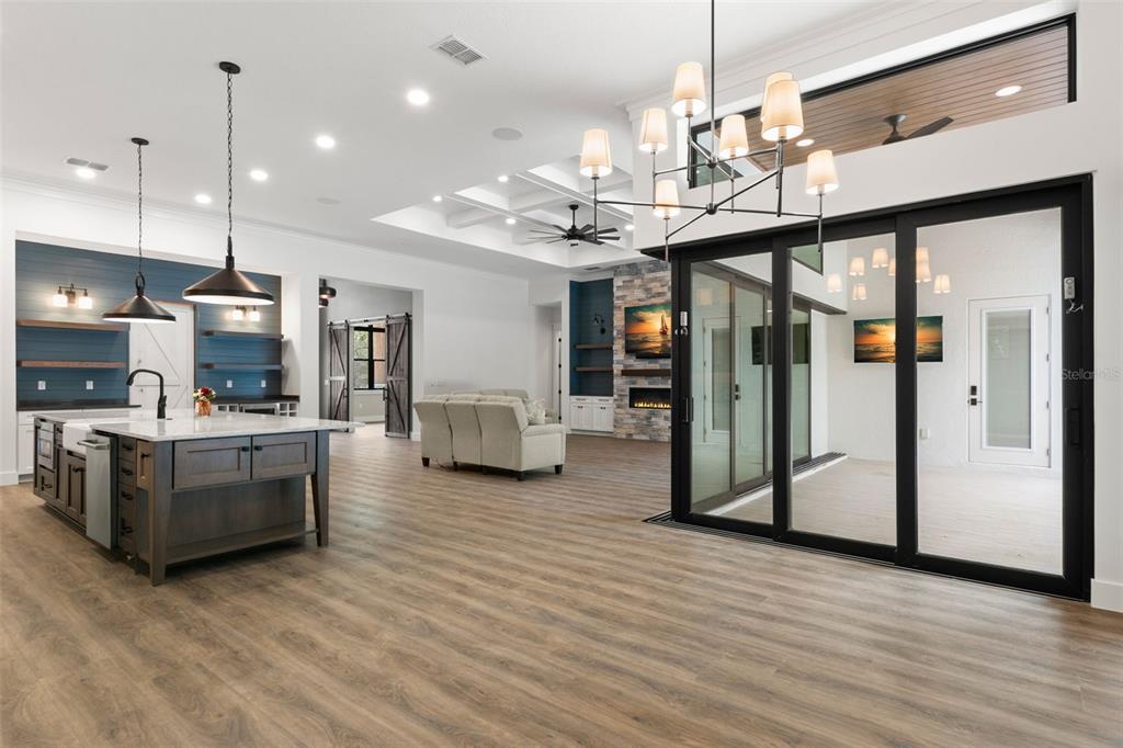 0 Plainview Road, Unit LOT 2 Odessa, FL 33556 - Photo 7 of 21 a open kitchen with stainless steel appliances granite countertop a refrigerator a oven and a wooden floors