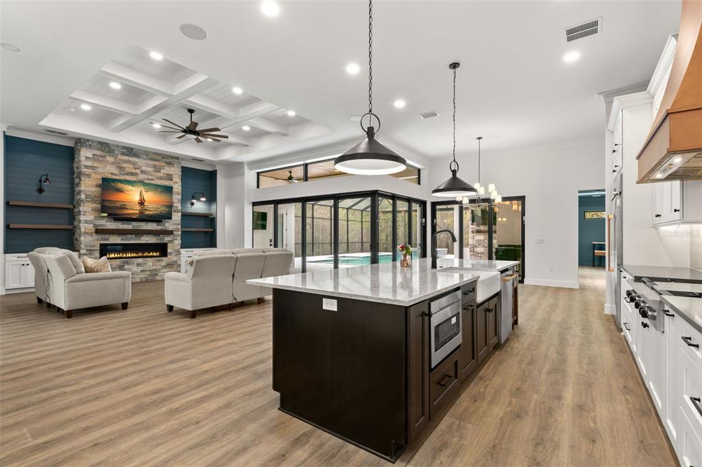0 Plainview Road, Unit LOT 2 Odessa, FL 33556 - Photo 10 of 21 a open kitchen with stainless steel appliances granite countertop a stove and a view of living room