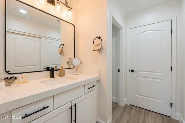 a bathroom with a sink and a mirror